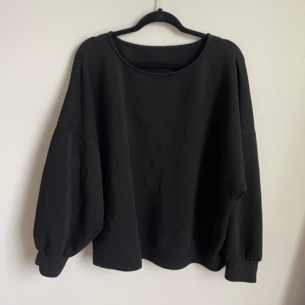 Lezé the Label sweater in black.